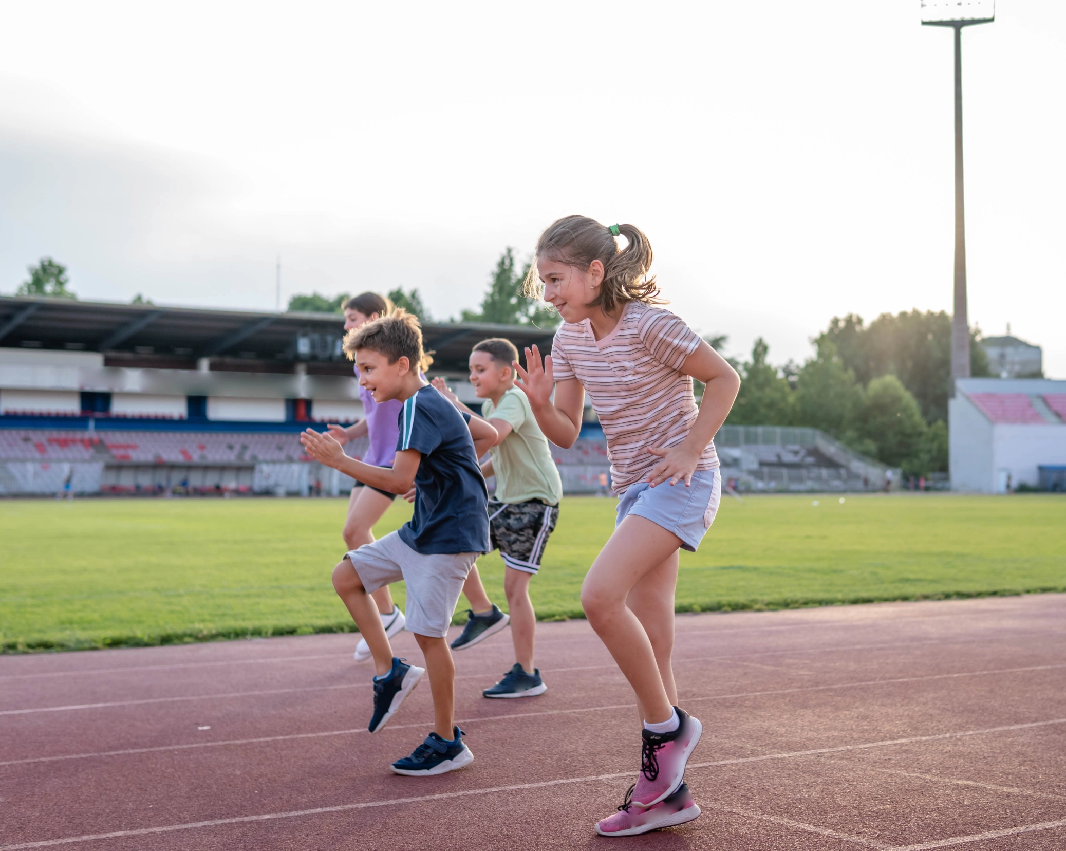 Young athletes sprinting together