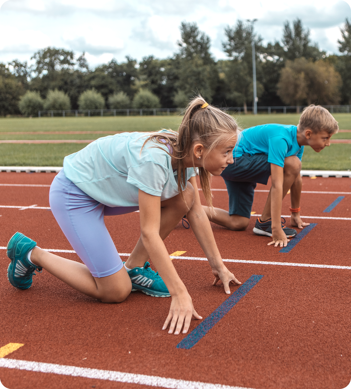 Young athletes in starting position outdoors